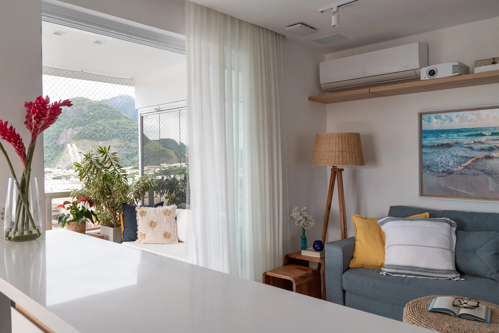 View of the living room with view to the balcony and mountains on the background